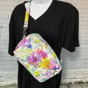 Black shirt with a colorful floral bag.